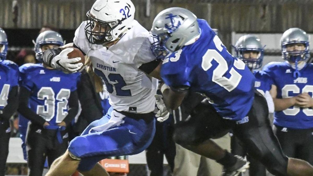 Lexington Christian Academy Dillon Wheatley (32) avoids Danville High Donlevy Harris (23) in the first quarter at Danville High School Friday October 21, 2016., in Danville, KY.
