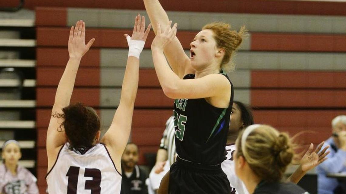 East Jessamines Emma Young scored on the Tates Creek defense on Wednesday February 10, 2016 in Lexington, Ky.