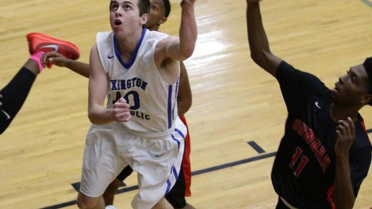 Lexington Catholic's Luke Johnson, 10, put in two of his 25 points as Dunbar defeated Lexington Catholic 63-63 on on Friday December 11, 2015 in Lexington, Ky.