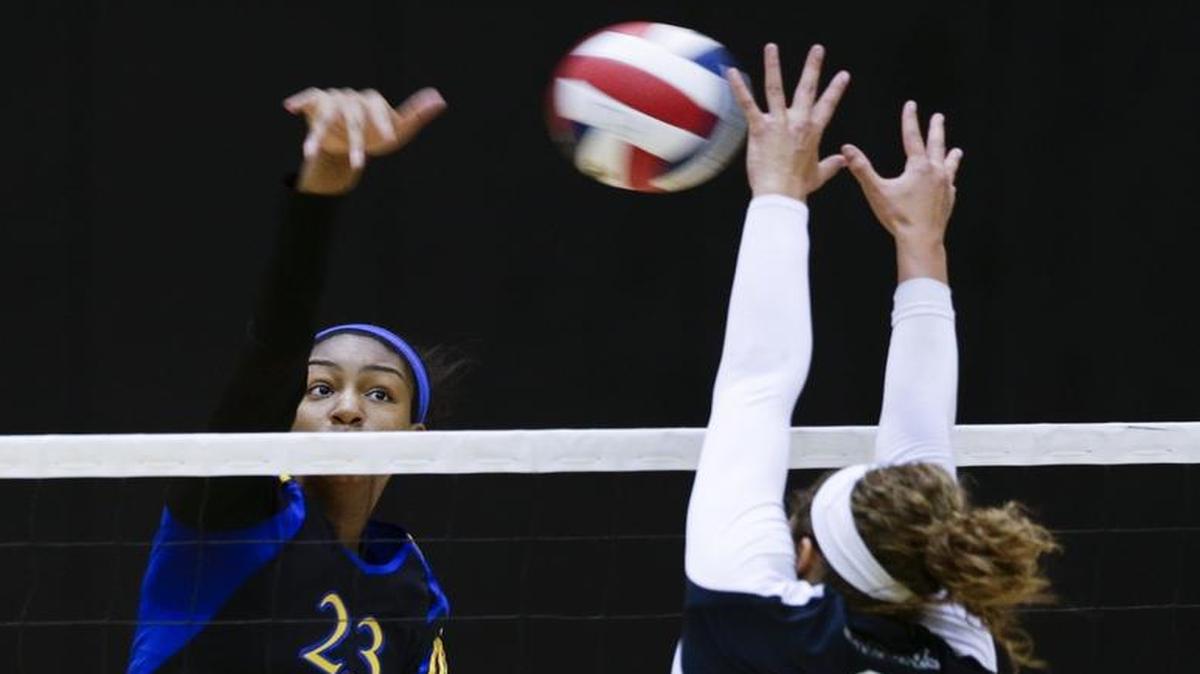 Henry Clay's Kaitlyn Hord, hit a shot over Tates Creeks Doris Carter, 9, as Henry Clay defeated Tates Creek for the 11th region championship on Thursday October 29, 2015 in Lexington, KY. Photo by Mark Cornelison | Staff