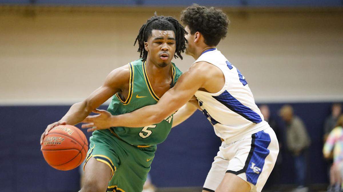 Bryan Station’s Amari Owens (5) drives against Lexington Catholic’s Mac Aaron during the White, Greer & Maggard Holiday Classic quarterfinals at Lexington Catholic on Saturday.