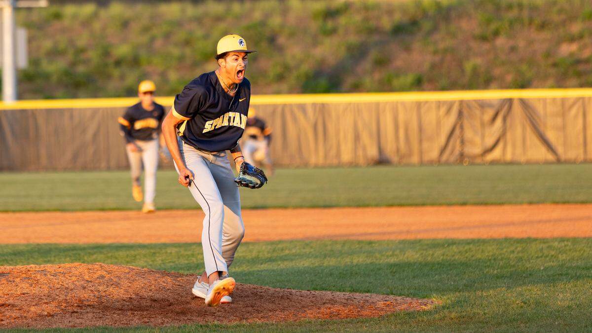Sayre’s Jaxson Howard celebrated getting a strikeout to finish a 7-6 Spartans win over Scott County at Scott County High School in Georgetown on Wednesday.