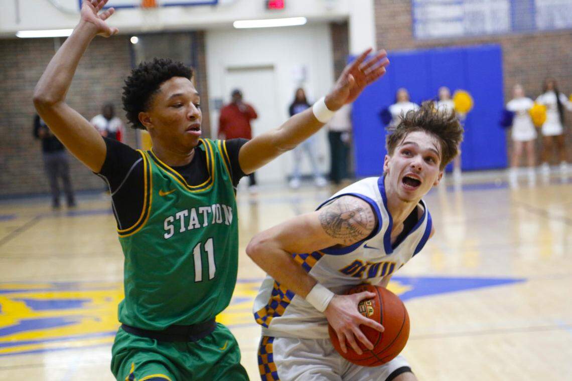 Henry Clay’s Kayson Brown drives against Bryan Station’s Montae Ashford during the Blue Devils 63-58 win over the visiting Defenders at Henry Clay High School on Friday.