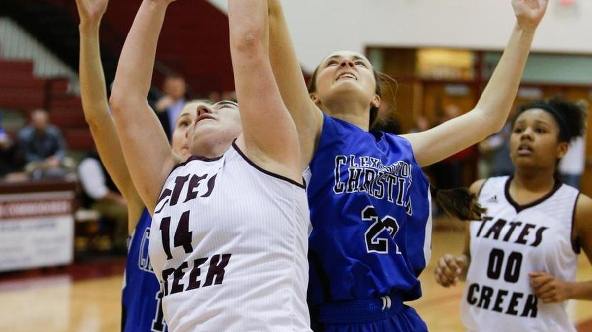 Tates Creek's Lauren Miller, 14, battled LCA's Faith Osborne for a rebound as LCA beat Tates Creek 49-48 in 43rd district tournament on Monday February 23, 2015 in Lexington, Ky.