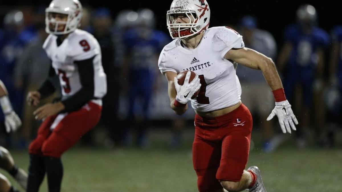 Lafayette High School's Mason Alstatt runs the ball against Simon Kenton High School during the first half of their Class 6A semifinal football game played at Simon Kenton High School Friday, November 27, 2015.