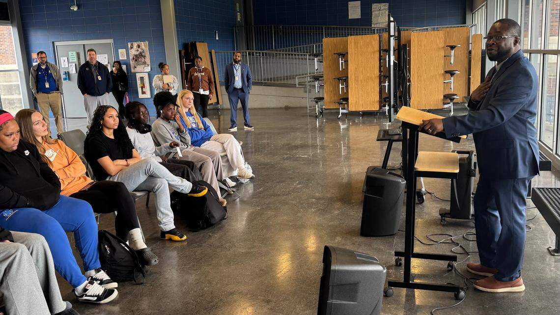 New Henry Clay High School girls basketball head coach Brian Tribble, right, spoke to members of last season’s team, school officials and parents gathered for his introduction at the school on Monday.
