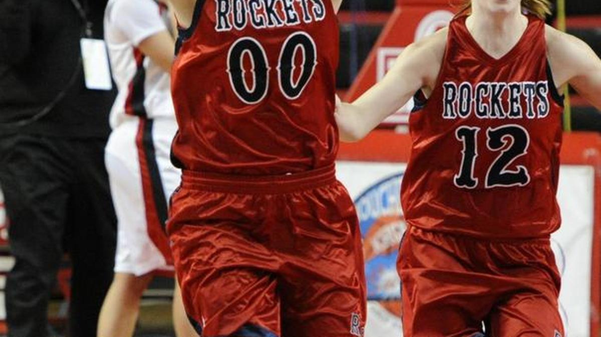 Rockcastle County's Sara Hammond (00) and Angie Lawrence celebrate their 62-60 overtime win over DuPont Manual Saturday, March 12, 2011, in a girls' high school basketball game during the finals of the KHSAA Girls' Sweet 16 state tournament at Diddle Arena in Bowling Green, Ky.