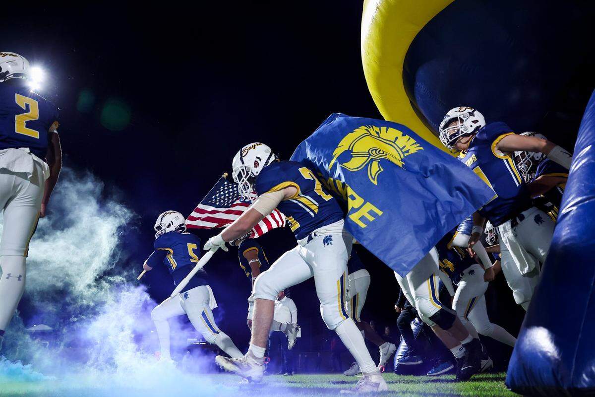Sayre takes the field for each home game though its giant inflatable Spartans helmet, seen here ahead of a district game against Eminence in 2023.