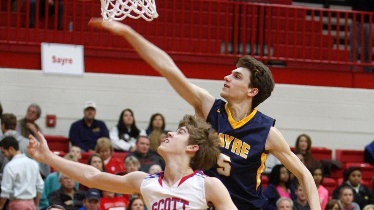 Sayre’s Jake Duby tried to block a shot by Scott County’s Bryce Long during last season’s 42nd District Tournament. Duby led Lexington players in scoring at 24.1 points per game.