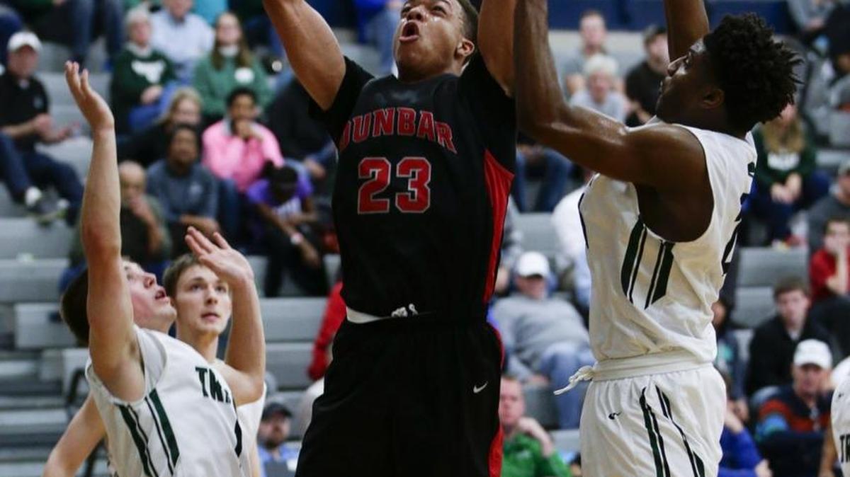 Dunbar's Darius Williams put in two of his 20 points as Dunbar defeated Trinity 71-60 on Wednesday December 30, 2015 in Lexington, Ky.