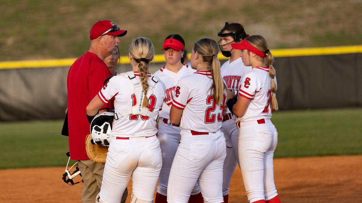 Scott County softball coach Mike Wagoner spoke to his infield after Lexington Catholic loaded the bases in the sixth inning of the Cardinals’ 3-1 win over the Knights at Scott County High School in Georgetown on Tuesday.