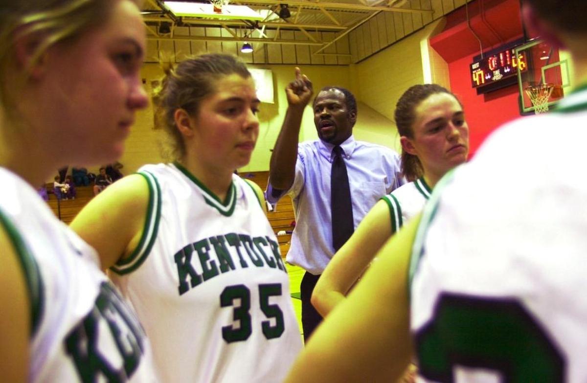 File photo: James Alcorn, the assistant coach of the girls’ basketball team at the Kentucky School for the Deaf, tries to communicate with his players during their game against the Tennessee School for the Deaf, Danville, Ky., on Dec. 14, 2000. Alcorn, who didn’t know any sign language when he took the job, caught on to sign language quickly because it’s the only way to communicate with the girls.