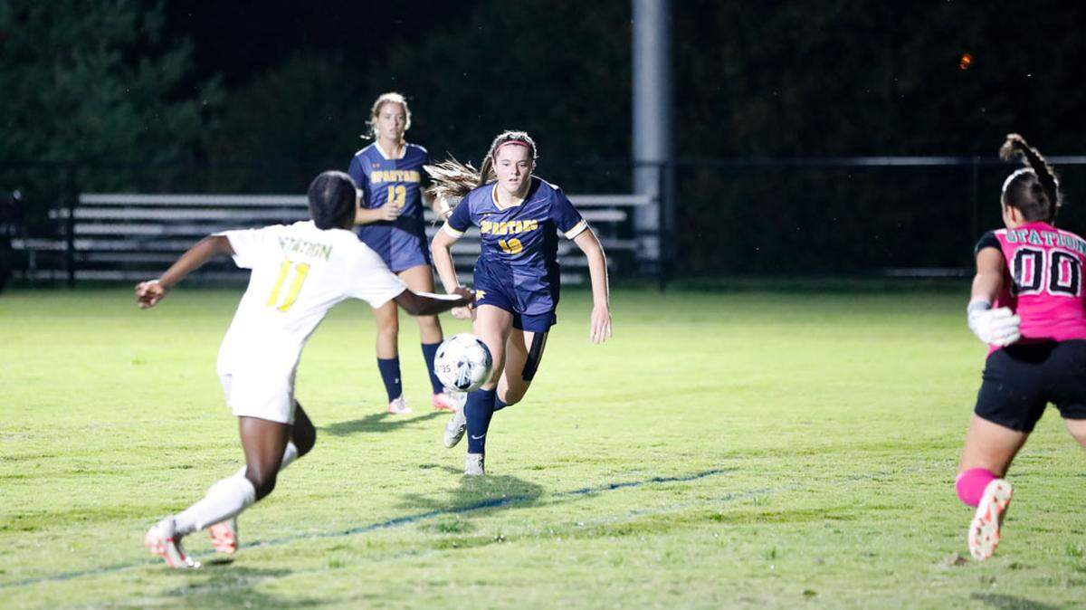 Sayre’s Katherine Monohan (10) moves in to try for a shot against the defense of Bryan Station’s Carliya Dobson (11) and Sofia Haggard (00) during the Spartans’ 7-0 win over the Defenders at Sayre Athletic Complex on Wednesday.