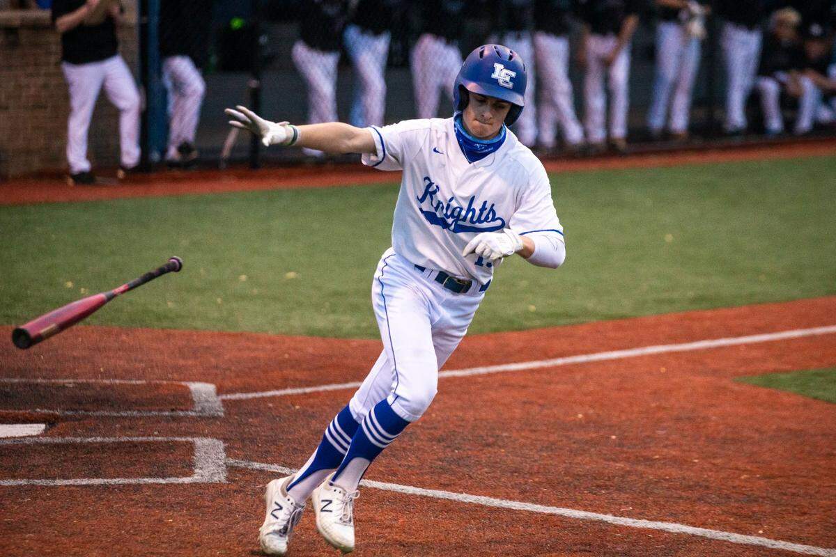 Lexington Catholic’s Griffin Cameron (15) tosses his bat after being walked during a game against Tates Creek on April 27, 2021. He batted .405 with 20 RBI last season.