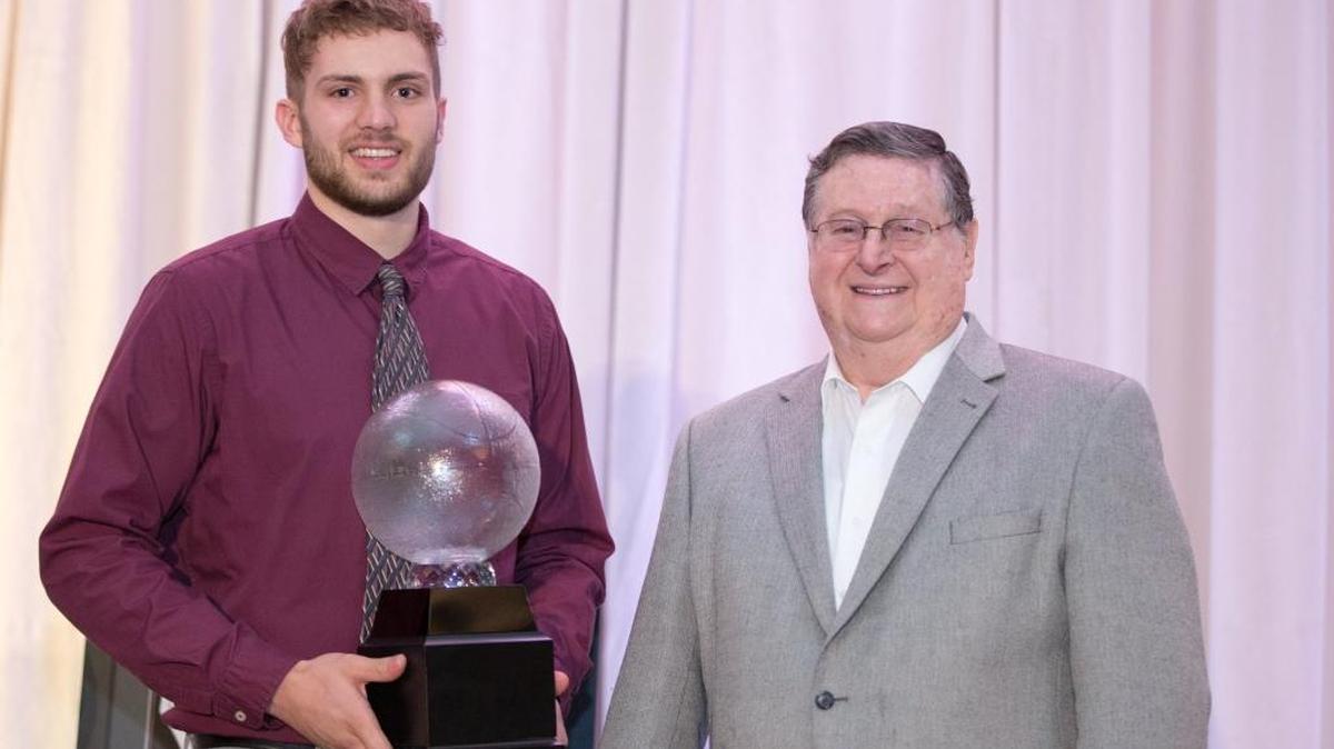 UK Coach Joe B. Hall presented Carson Williams with the Mr. Basketball trophy at the Lexington Center’s Bluegrass Ballroom on Tuesday, March 15, 2016, in Lexington.