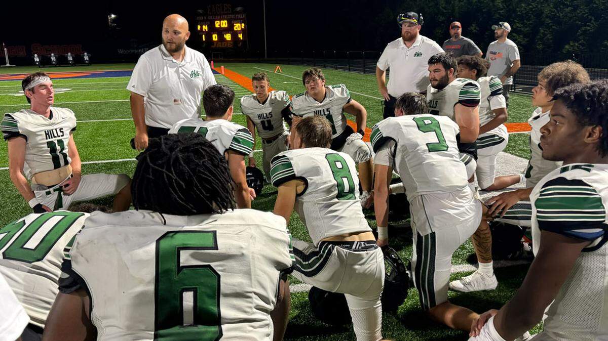 Western Hills High School football coach Simon Vanderpool talks to his team after a scrimmage last week. Vanderpool immediately liked what he saw of Javeon Campbell on the football field but said, “I don’t think anyone would have ever imagined he would blow up to be one of the hottest recruits in the country.”
