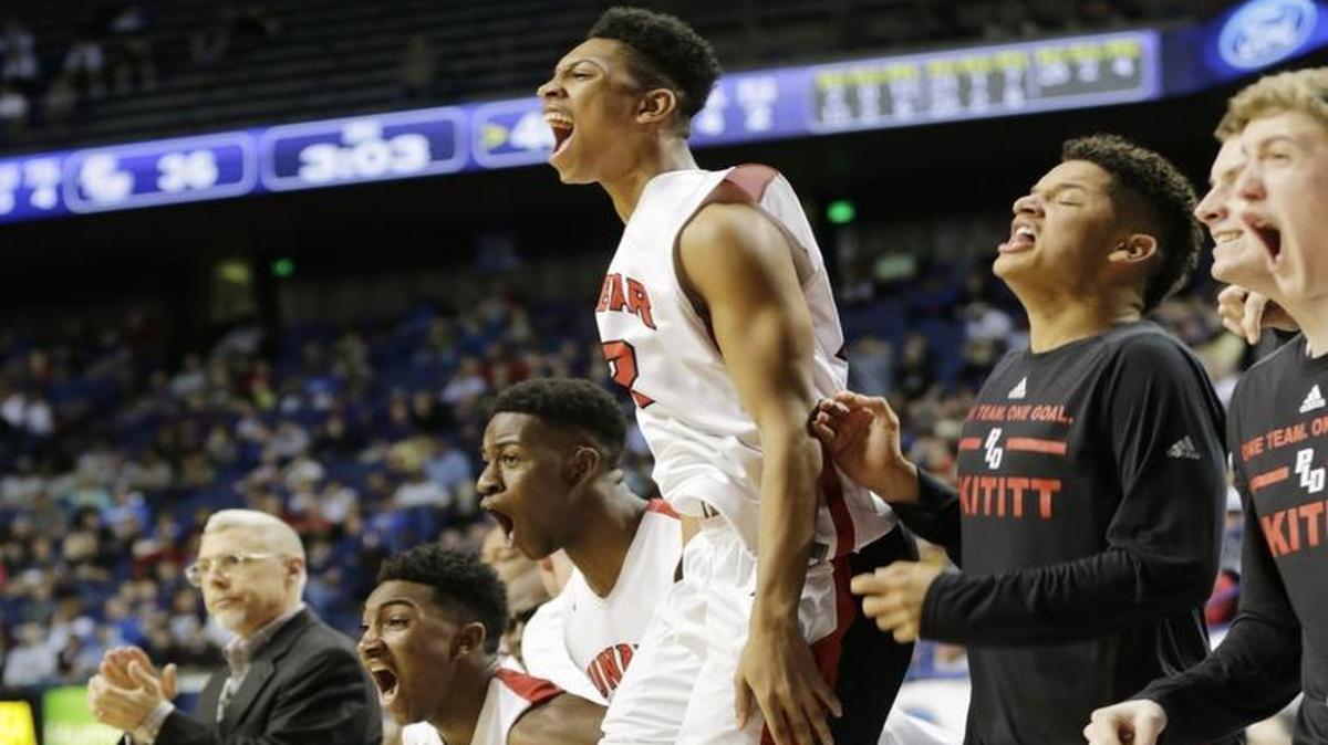The Dunbar bench erupted as Justin Kelly scored in the third quarter of the Dunbar vs Bowling Green 2016 Whitaker Bank/KHSAA Boys Sweet 16 basketball tournament quarterfinal game at Rupp Arena in Lexington, Ky., on March 18, 2016.