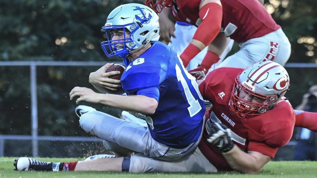 Danville’s Zack Dampier (18) was sacked by Corbin’s Hunter Logan (35) on Friday, Sept. 9, 2016, at Danville High School.