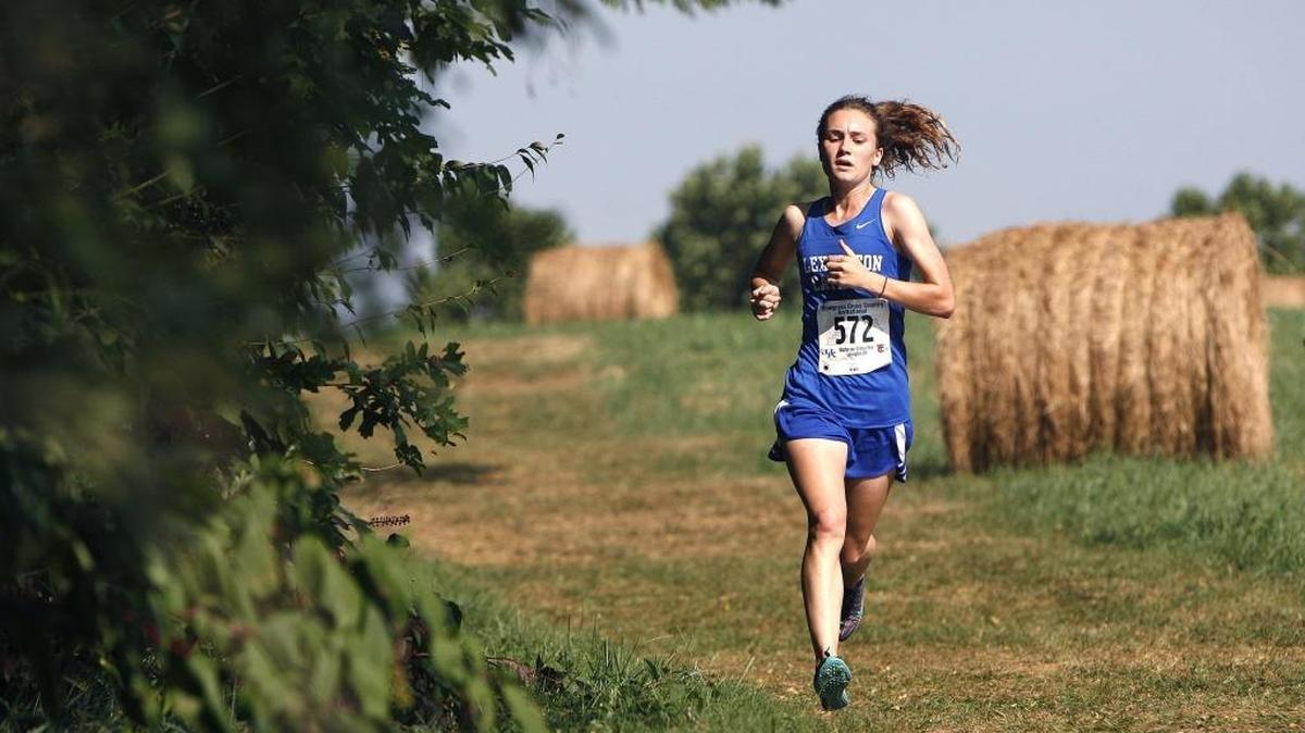 Lexington Catholic's Michaela Reinhart leads before winning the varsity girls 5k at the Bluegrass Cross Country Invitational at Masterson Station Park in Lexington, Ky., Saturday, September 10, 2016.