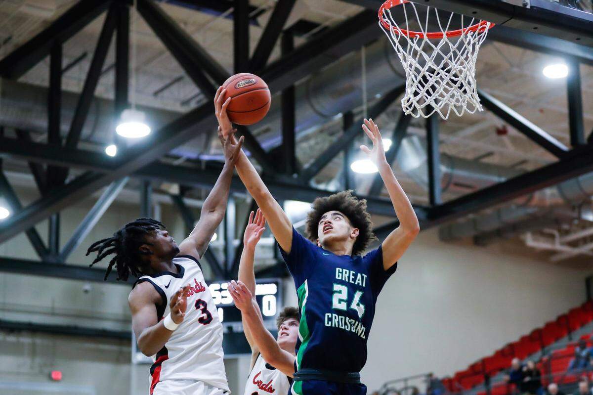 Great Crossing’s Malachi Moreno (24) took a rebound away from George Rogers Clark guard Reshaun Hampton (3) during their game at George Rogers Clark High School in Winchester on Jan. 5.