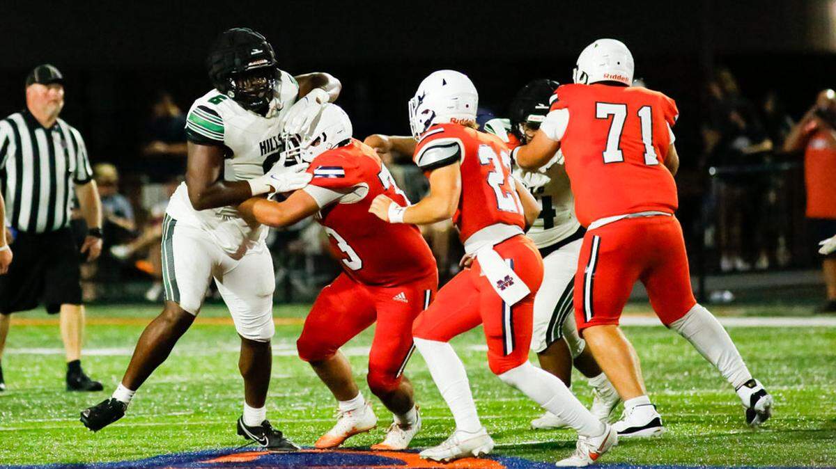 Western Hills’ Javeon Campbell, left, tries to shed a Madison Southern blocker during their scrimmage at Madison Southern High School in Berea last week. Campbell, known more in the 11th Region as a basketball player, exploded on the national football recruiting scene after playing only one season of high school football.