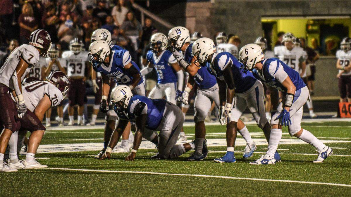 Lexington Christian’s Kenyatta Hardge (11), Major Brown (19) and the rest of the Eagles’ defense prepared to line up against Pikeville in during Saturday’s 31-13 win at White, Greer & Maggard Stadium.