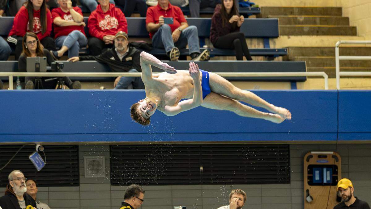 Lexington Catholic’s Graham Leslie performed a twisting dive during the KHSAA Boys State Diving Championships at the University of Kentucky’s Lancaster Aquatic Center in Lexington, Kentucky, on Friday, Feb. 20, 2026.