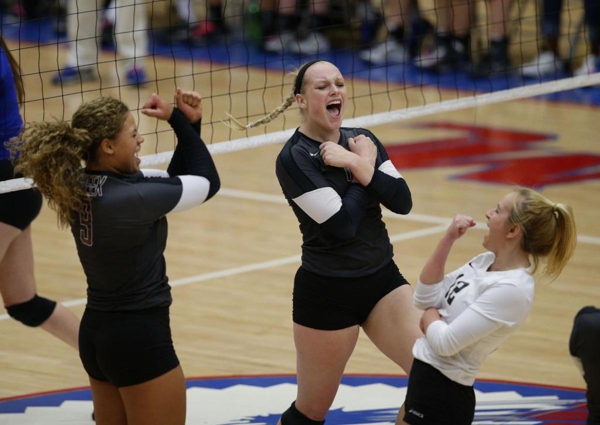 Tates Creek’s Doris Carter, left, Lindsey Wilkins, center, and Macy Reihing (12) celebrated a key point during 2016’s 11th Region championship game against Henry Clay in Richmond.