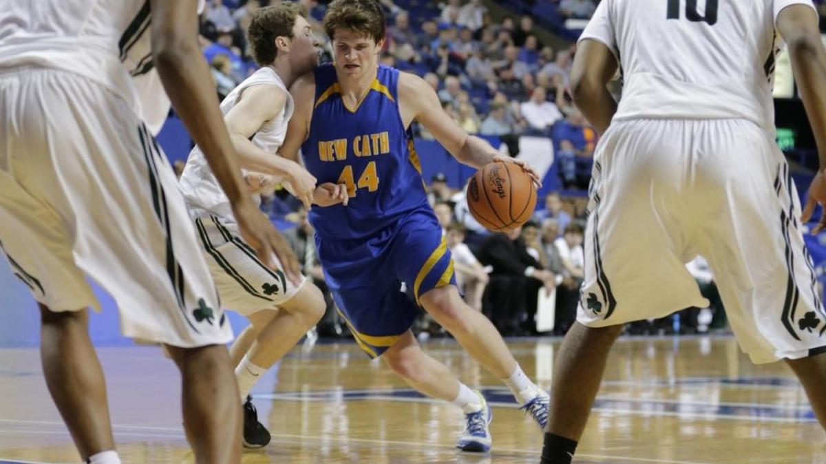Newport Central Catholic's Ben Weyer (44) drove to the basket.