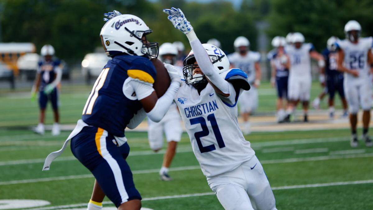 Franklin County’s Delano Collins pulled in a reception in front of Lexington Christian defender Jeremiah Burbage during the Flyers win over LCA in the Rebel Bowl at Boyle County High School in Danville on Aug. 31.