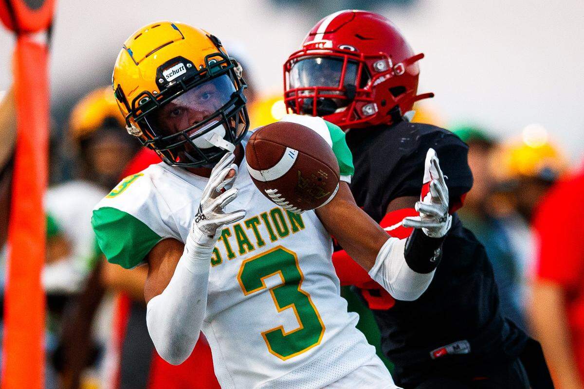 Bryan Station Defenders wide receiver JT Haskins Jr catches a pass during the game against the Scott County Cardinals on Friday, Sept. 9, 2022, at Great Crossing High School in Georgetown, Kentucky.
