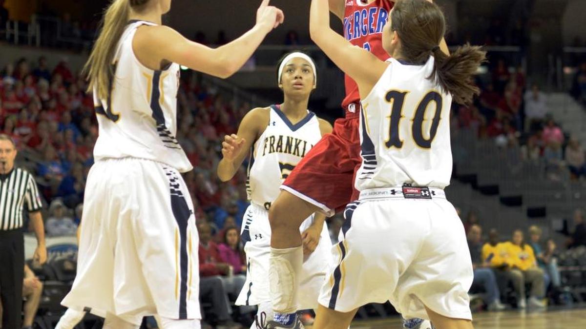 Mercer County’s Calicia Smith shoots through the Franklin County defense during the semifinals of the KHSAA girls’ sweet 16 high school basketball tournament at Northern Kentucky University, Saturday, March 12, 2016.