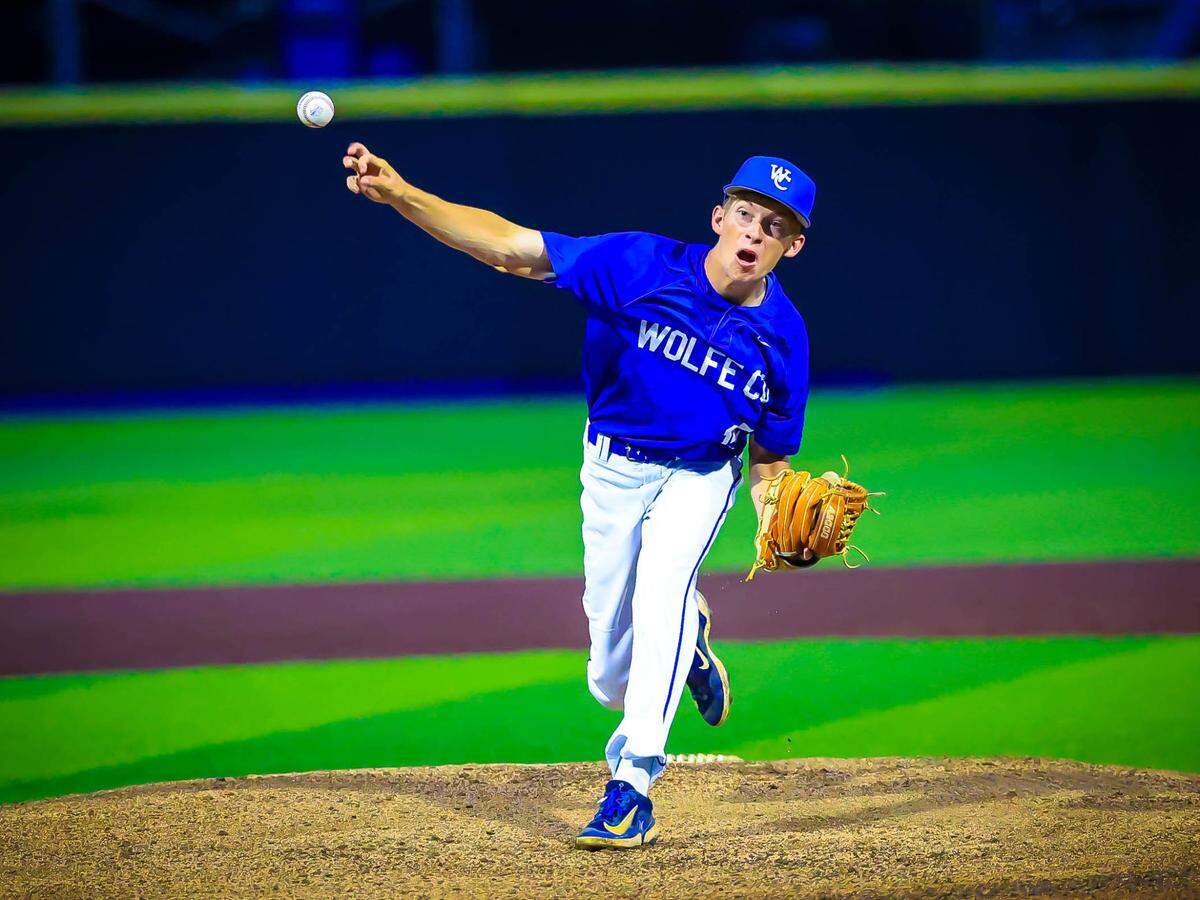 Wolfe County’s Jayden Hollon delivers a pitch during the Wolves’ rain-delayed game against Boyd County in the state baseball tournament at Kentucky Proud Park on Saturday.