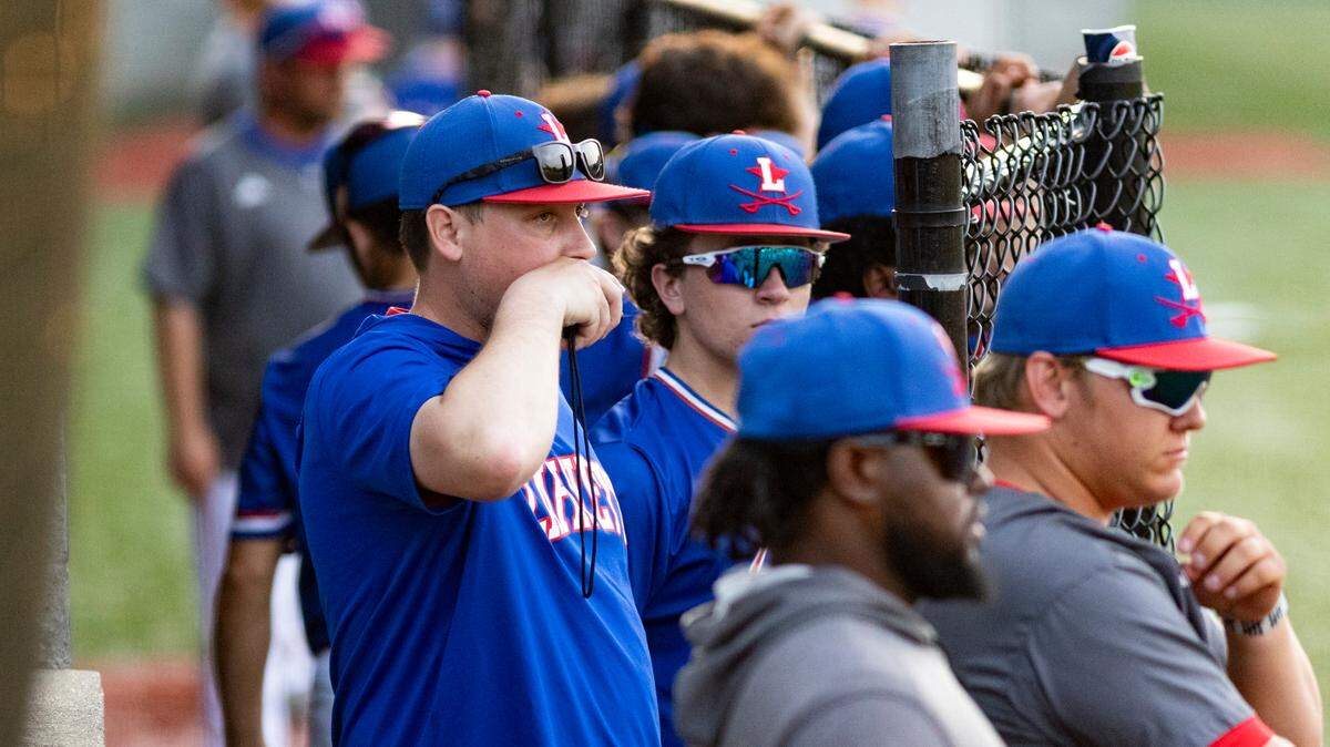 Lafayette pitching coach Brady Bowling holds a transmitter to his mouth as he calls a pitch for Generals catcher Micah Joy at Lexington Catholic High School on Wednesday.