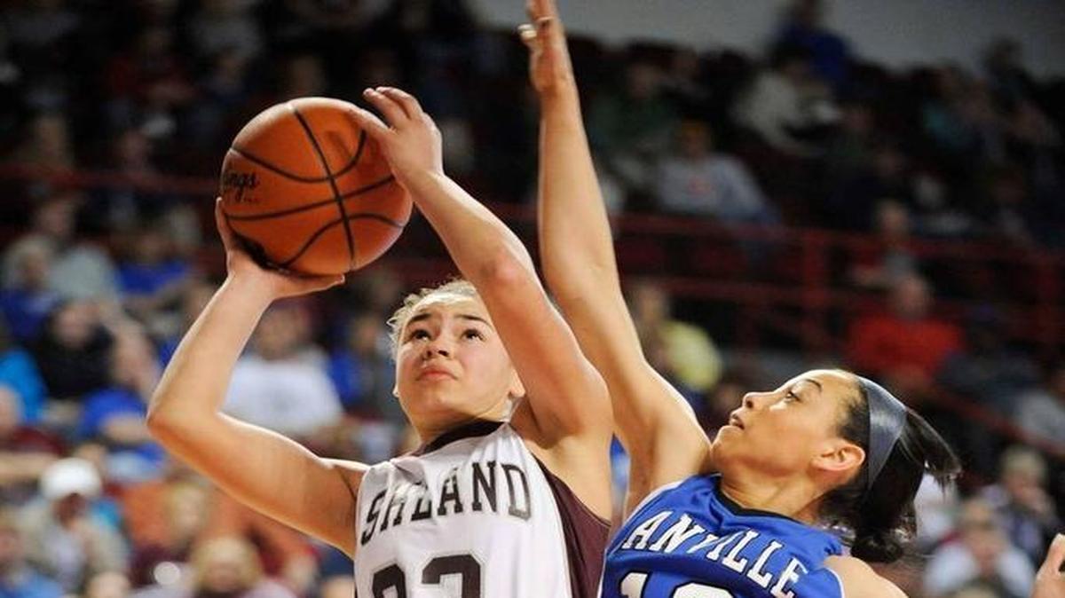 Ashland Blazer’s Mykasa Robinson (23) shoots past Danville's Cameron McPherson (12) during their quarterfinal game in the Houchens Industries/KHSAA Girls' Sweet 16 at E.A. Diddle Arena in Bowling Green, Ky., Friday March, 14, 2014.
