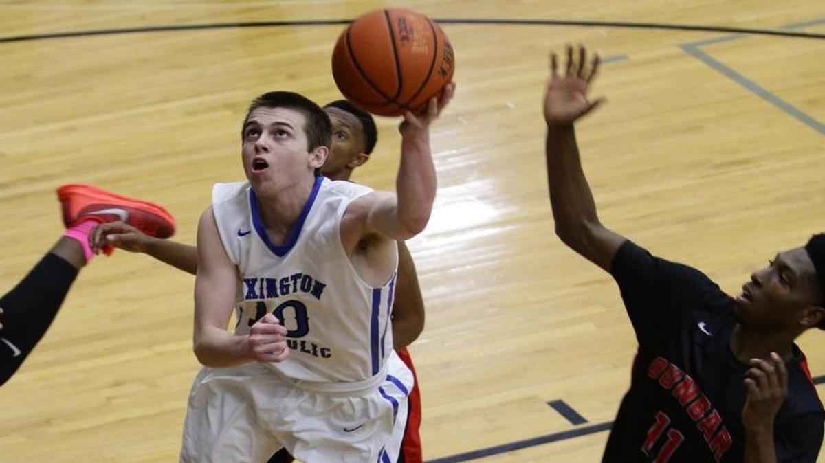 Lexington Catholic’s Luke Johnson (10) scored two of his 25 points in the host Knights’ 63-62 loss to Paul Dunbar on Friday, Dec. 11, 2015.