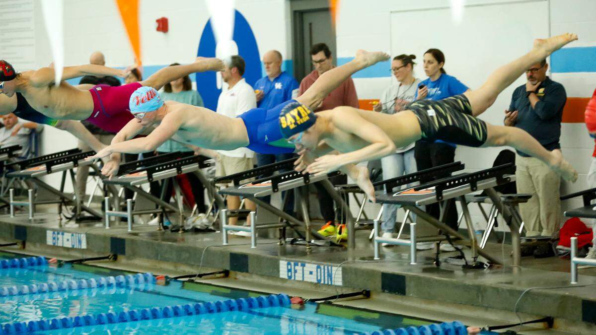 Lafayette’s Jimmy Rogers, left, earned most outstanding swimmer honors for his efforts that included winning the 200-yard individual medley over Sayre’s Max Yeoh at the Region 8 Swimming and Diving Championships at Stivers Aquatic Center in Barbourville on Saturday.