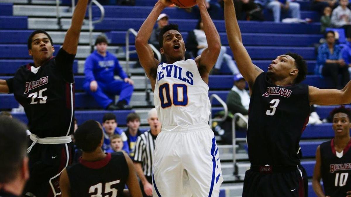 Henry Clay's Isaiah Tisdale pulled down a rebound in traffic as No.3 Henry Clay defeats No. 9 Ballard 61-57 on Monday February 1, 2016 in Lexington, Ky.