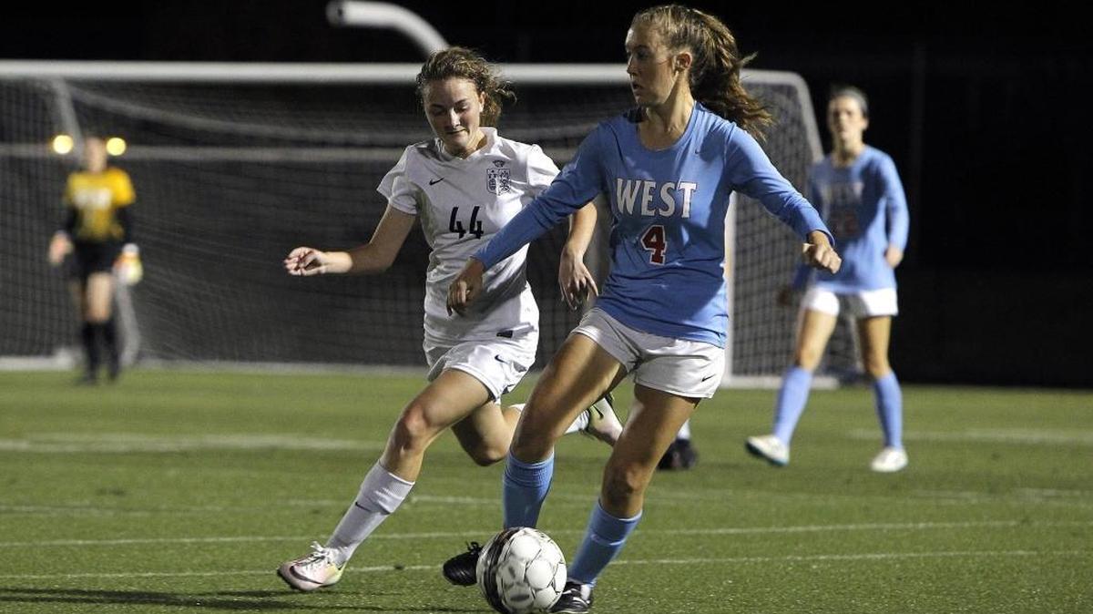 West Jessamine’s Saraya Young dribbles against Sacred Heart’s Brielle Heuglin during the semifinals of the KHSAA girls’ state soccer championship at Ishmael Stadium in Lexington, Ky., Thursday, November 2, 2017.