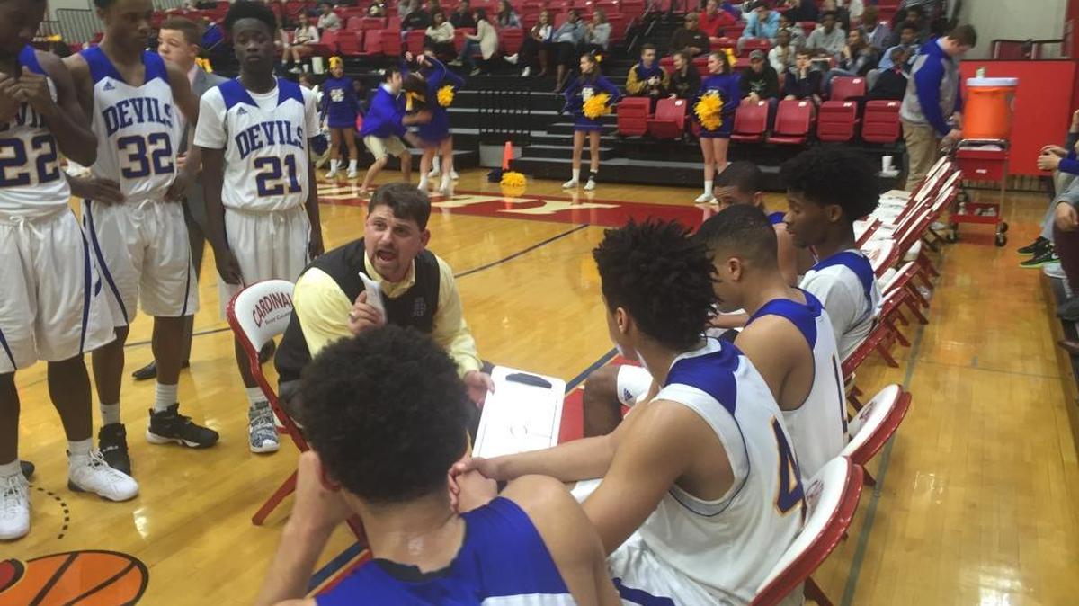 Henry Clay Coach Daniel Brown talked to his team during a break in the action against Bryan Station on Tuesday night in the 42nd District tournament at Scott County in Georgetown.