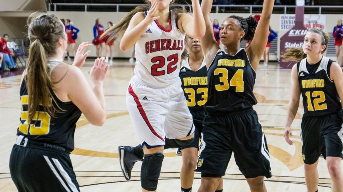 Lafayette's Kiara Pankins shoots in the lane past Woodford County's Chelsey Ford (34), during the opening round of the girls 11th Region Tournament, Tuesday night, March 3, 2015, at McBrayer Arena in Richmond. Lafayette won 62-42.