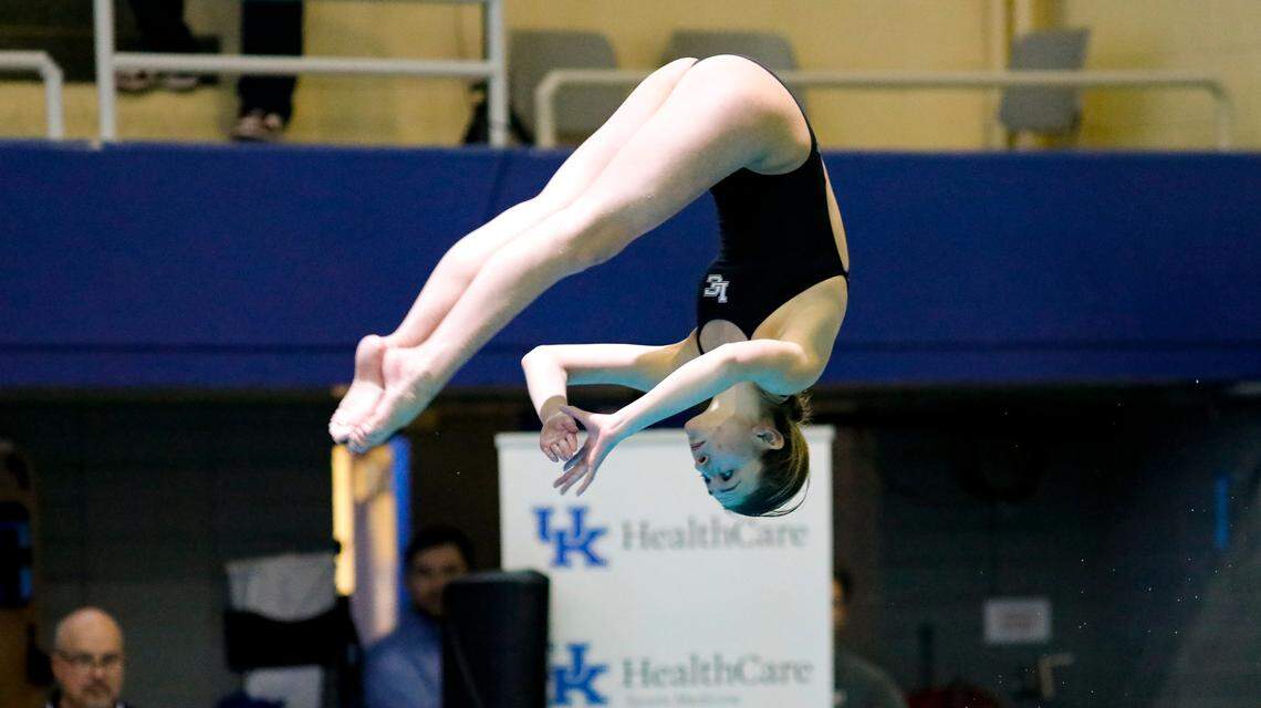 Lexington Catholic’s Sydney Leslie spotted the surface as she came out of a pike during the KHSAA Girls State Diving Championships at the University of Kentucky’s Lancaster Aquatic Center on Friday.