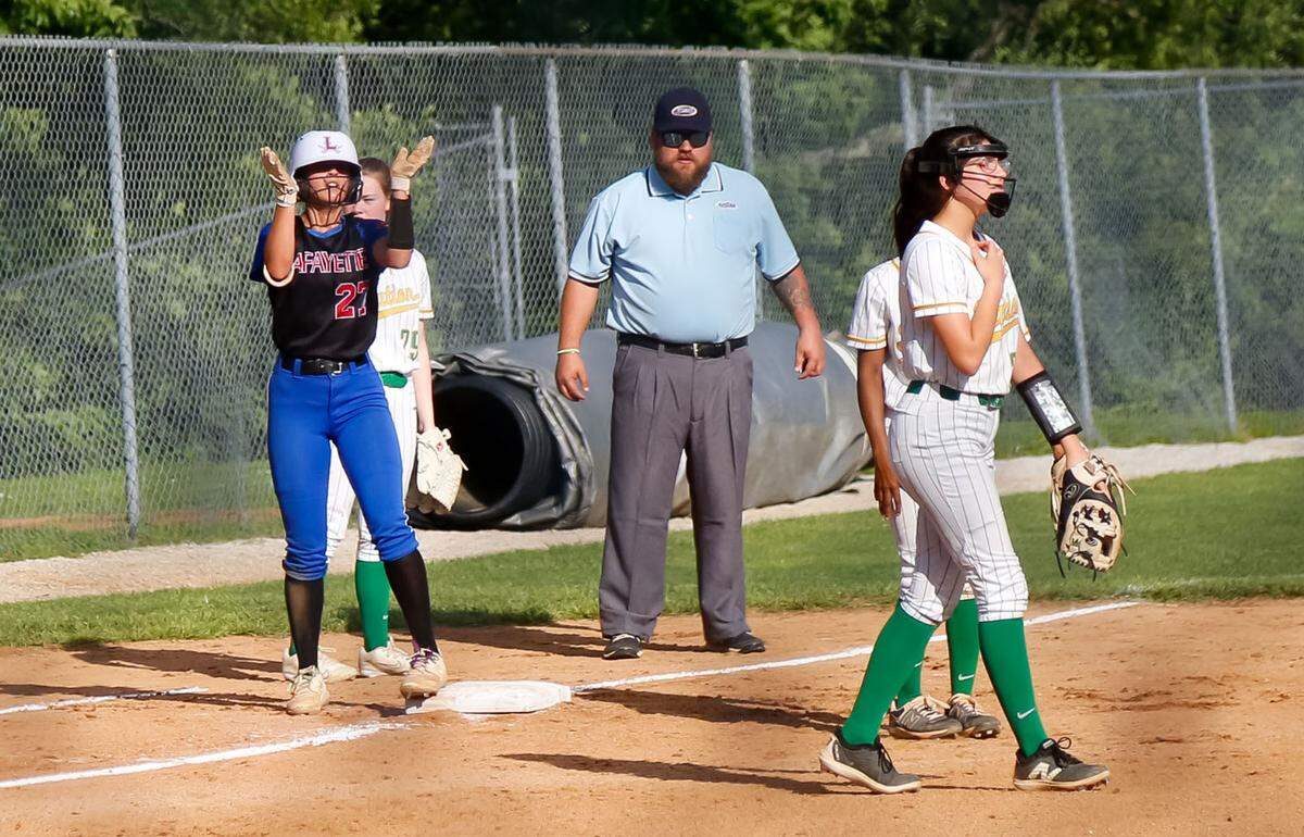 Lafayette’s Jenna Wells urges on her team after arriving at third base when her bunt was misplayed by Bryan Station in the third inning. Wells scored on the next play in the Generals’ 4-2 win.