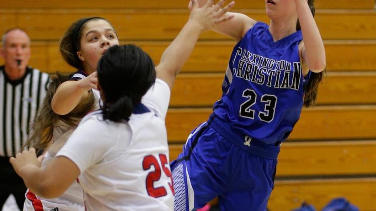 LCA’s Grace Combs put in a runner as Lafayette played Lexington Christian on Friday February 13, 2015 in Lexington, Ky.