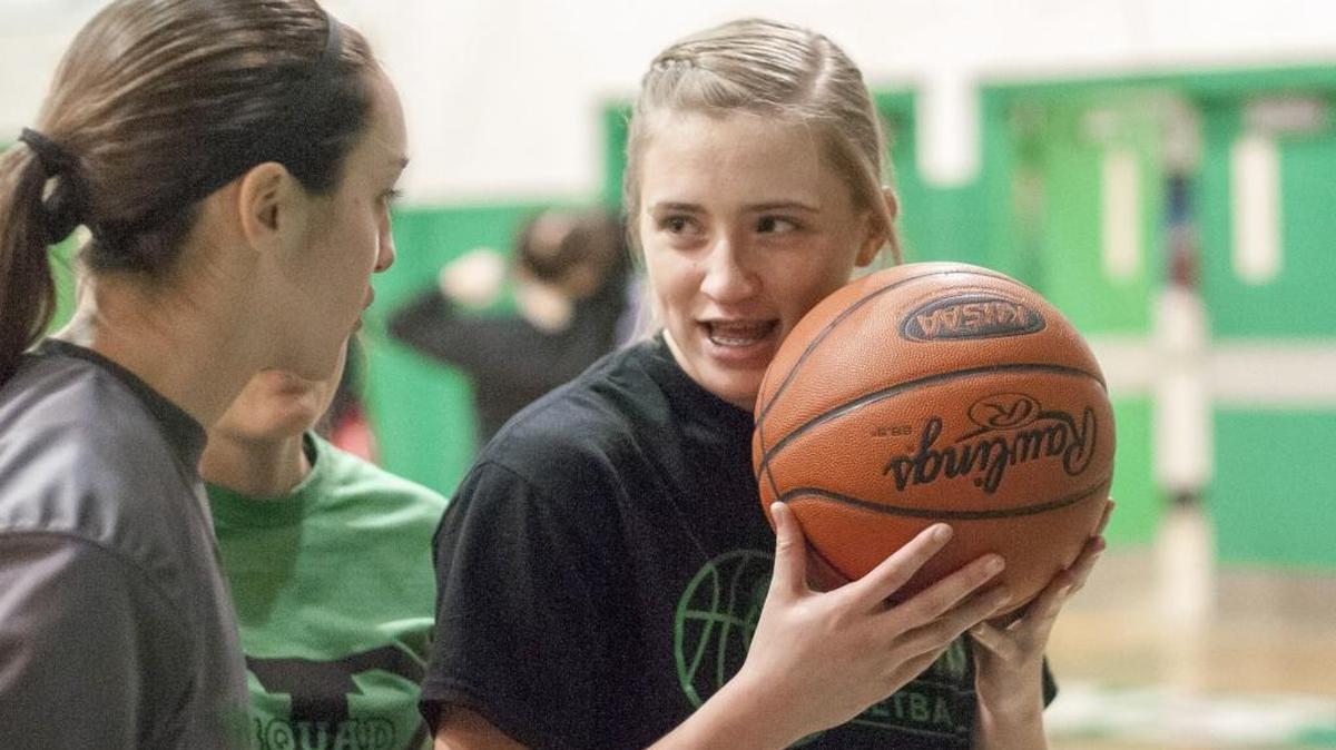 Jenkins High School senior Whitney Creech, right, talked with teammate Alexis Stambaugh before a game against Perry Central last week.