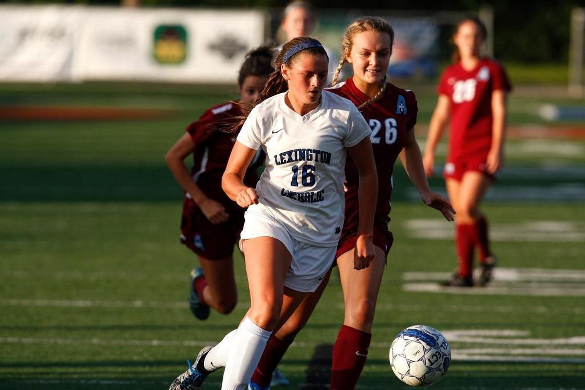 Lexington Catholic’s Kennedy Tranter dribbled against Assumption at Joseph Ford Stadium in Lexington on Aug. 22, 2016.
