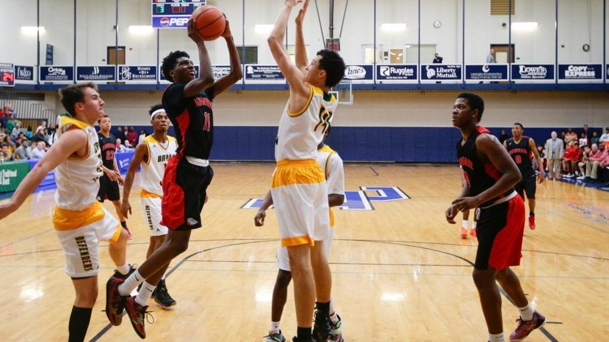 Paul Dunbar’s Taveion Hollingsworth scored two of his game-high 22 points against Bryan Station in a 75-40 victory in the Traditional Bank Holiday Classic on Dec. 29, 2015, in Lexington.