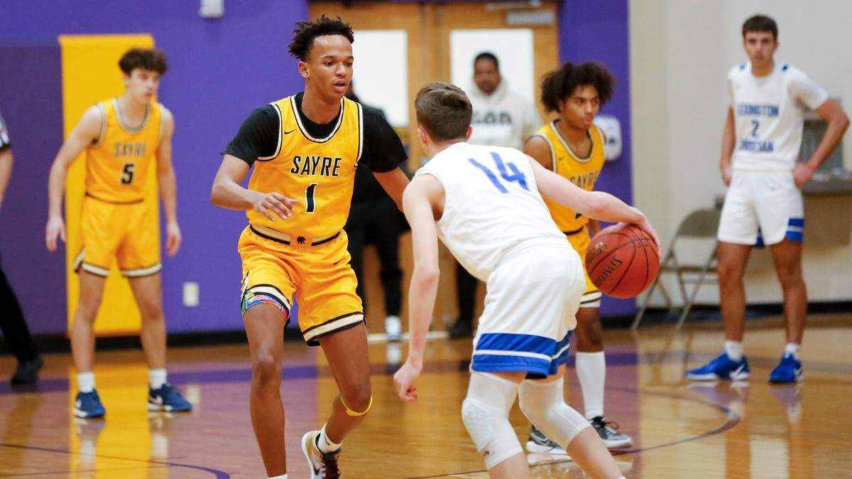 Sayre’s Chase Parker (1) defended the approach of Lexington Christian’s Chase Bentley during the Spartans’ 55-41 win over the Eagles in the boys 11th Region All “A” Classic tournament at The Frankfort Christian Academy in Frankfort on Sunday.