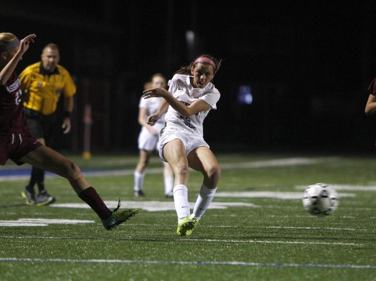 LexCath's Kennedy Tranter shoots on goal to score her second goal in the first half against Assumption during the Lady Knights Challenge Cup on the pitch at Lexington Catholic in Lexington, Ky., Weds., September 17, 2014. Photo by Matt Goins