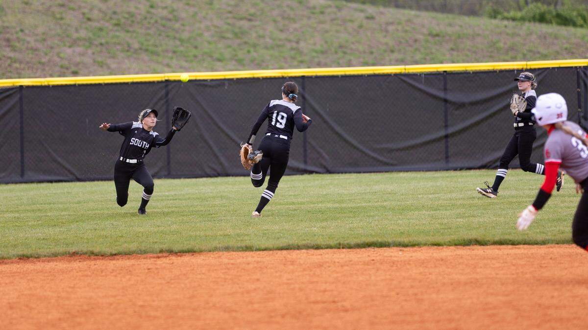 South Warren left fielder Kaylee Wilson tracks down a fly ball during the Spartans’ 14-1 win over Scott County at Scott County on Saturday.